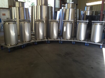 60 GAL. SPIRITS HOLDING TANKS ON CASTERS TO MOVE ANYWHERE IN THE DISTILLERY